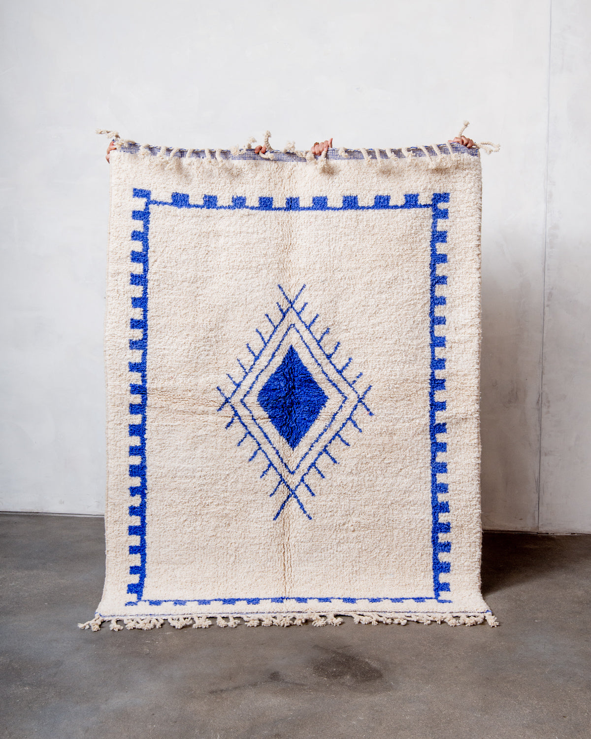 Modern, designer, handcrafted Berber rug from Morocco. Beniourain carpet with beautiful colours and patterns and fluffy wool texture.